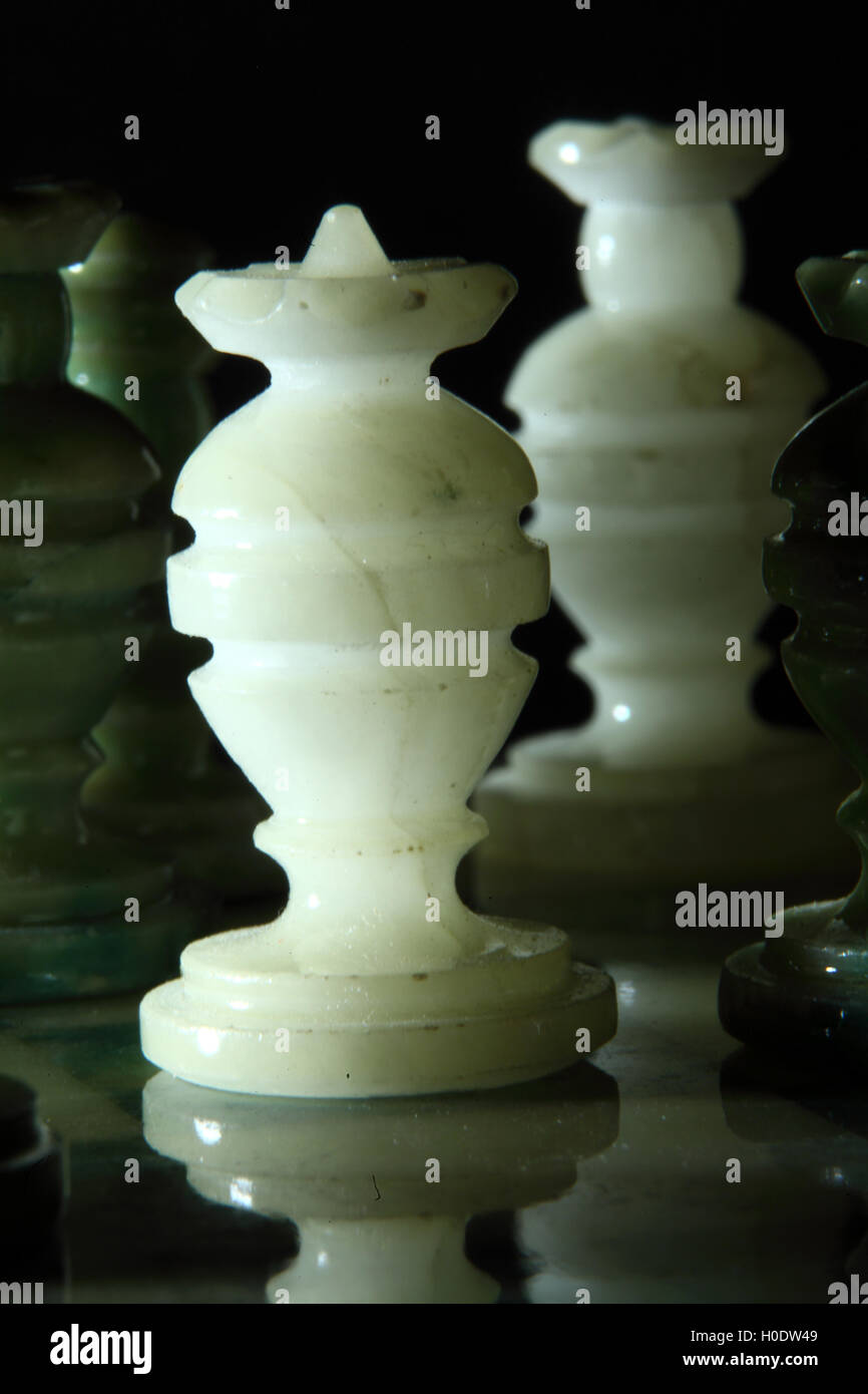 chessboard and alabaster chess on a black background Stock Photo - Alamy