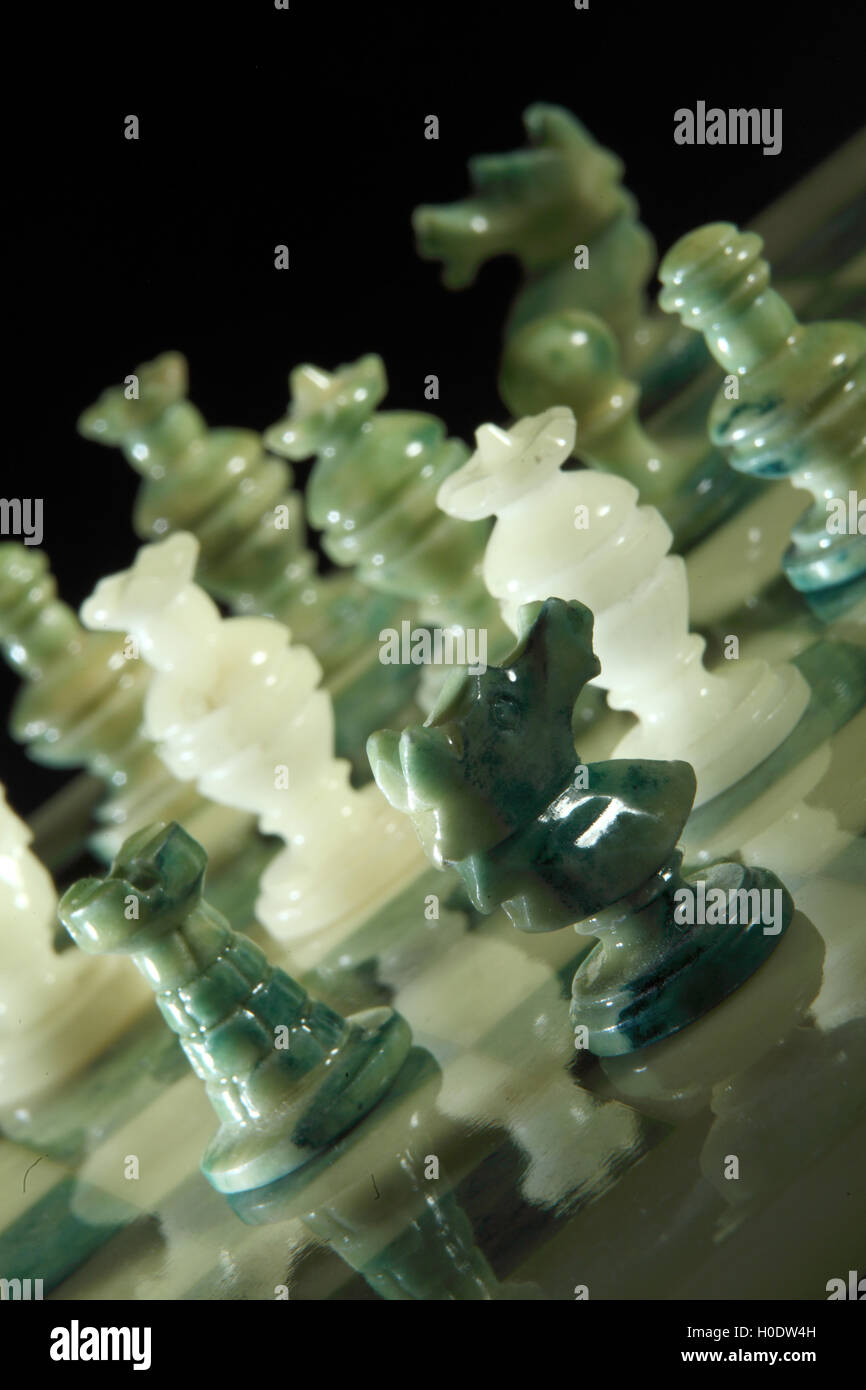 chessboard and alabaster chess on a black background Stock Photo - Alamy