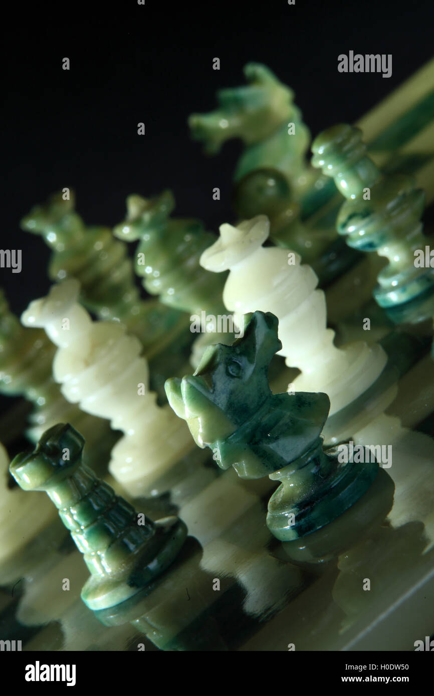 chessboard and alabaster chess on a black background Stock Photo - Alamy