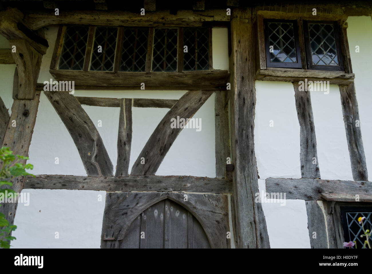 Timber framed building in England, United Kingdom. Oak wood structure with wattle and daub infill. Painted with lime whitewash. Stock Photo