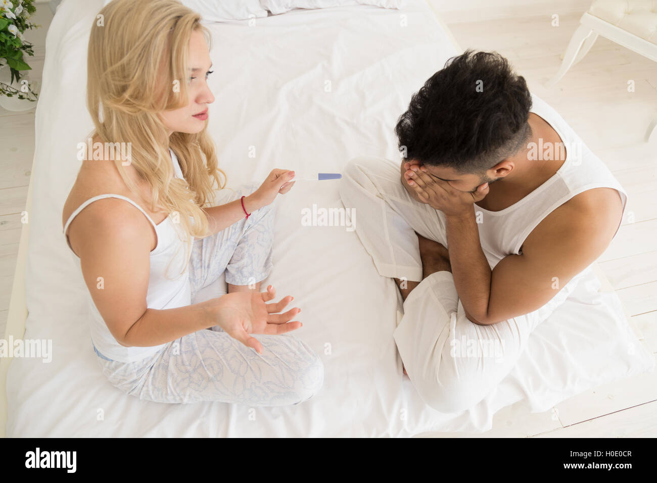 Couple Sitting Bed Argue, Having Conflict Relationships Problem, Sad Negative Emotions Stock Photo