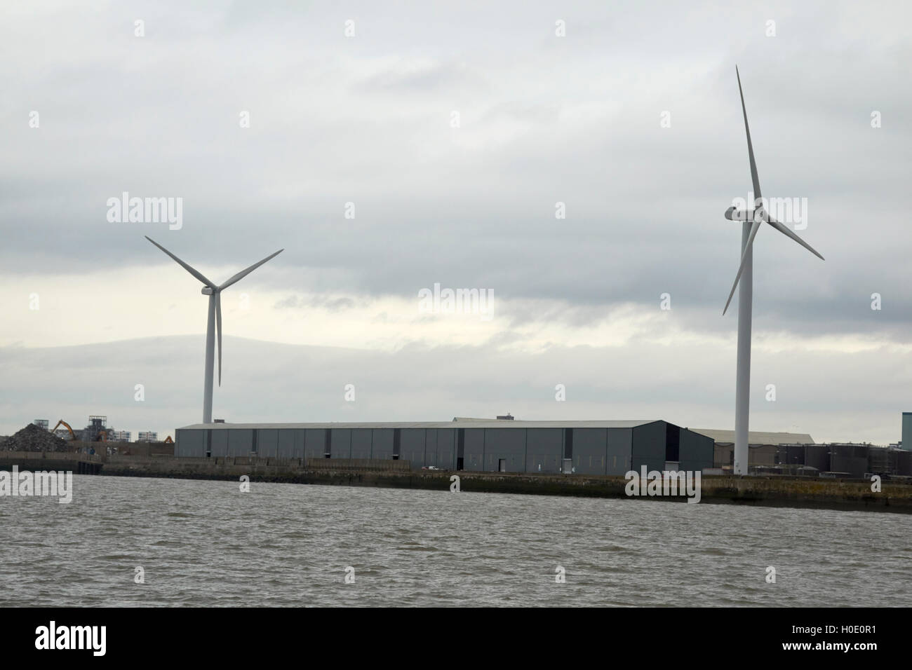 wind turbines and commercial buildings on langton dock Liverpool Merseyside UK Stock Photo