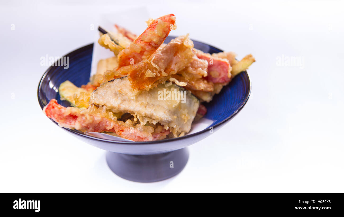 Vegetable tempura on blue chinese plate on white background Stock Photo