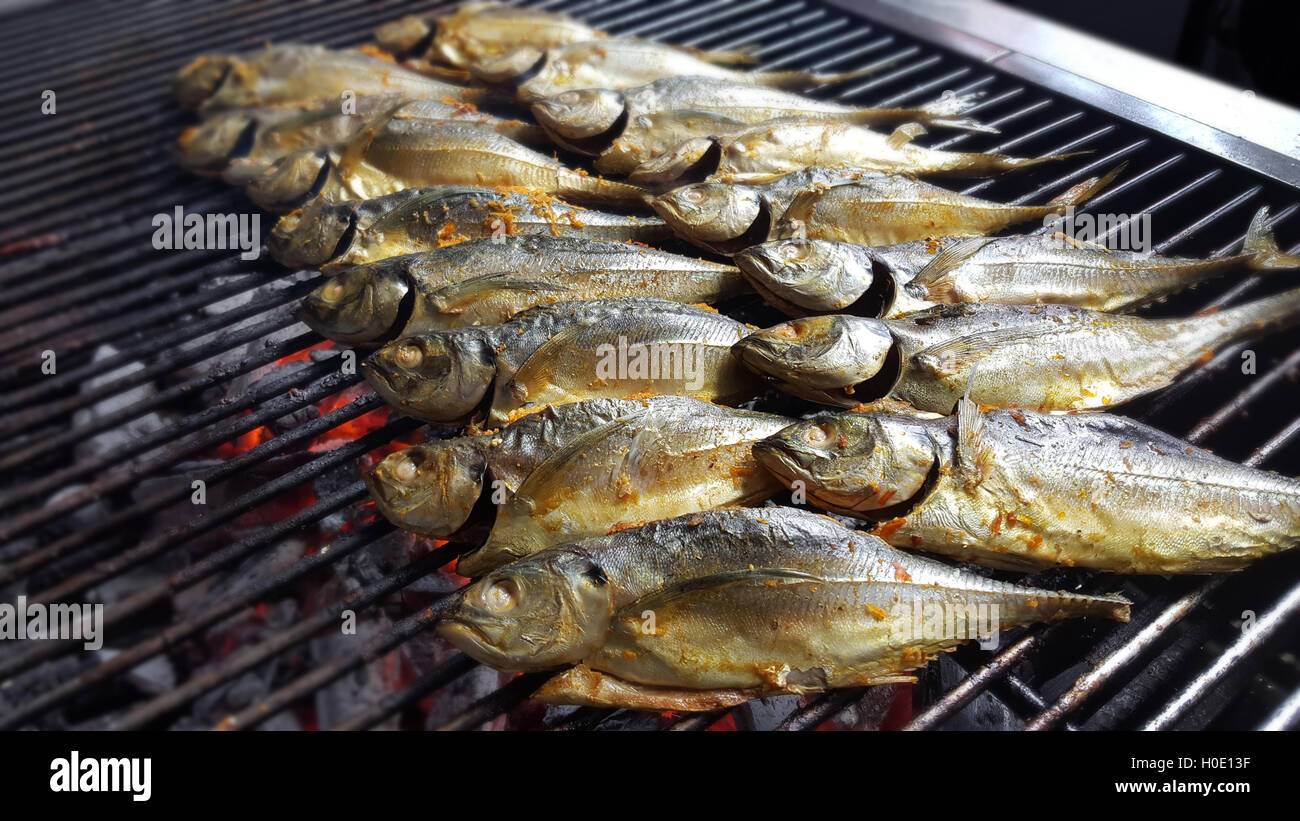 The outdoor barbecue corner serves freshly grilled fish on hot charcoal Stock Photo