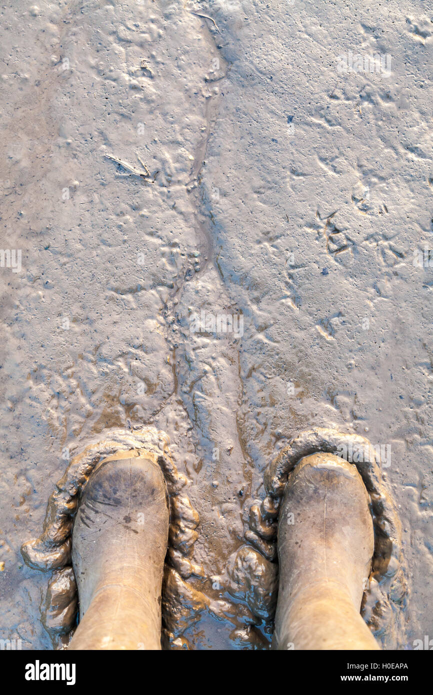 Boots stuck in the mud Stock Photo