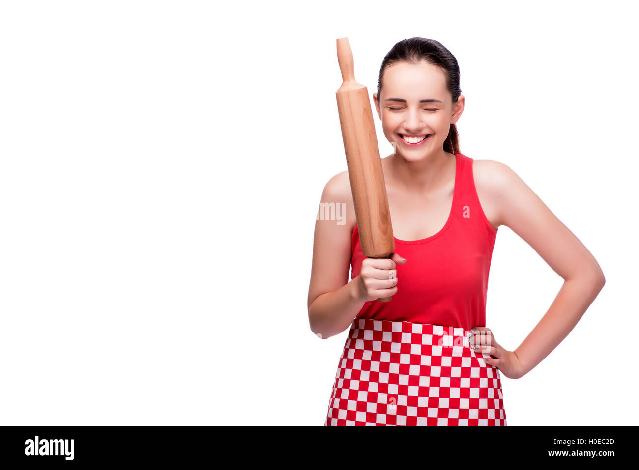 Young angry woman with rolling pin isolated on white Stock Photo