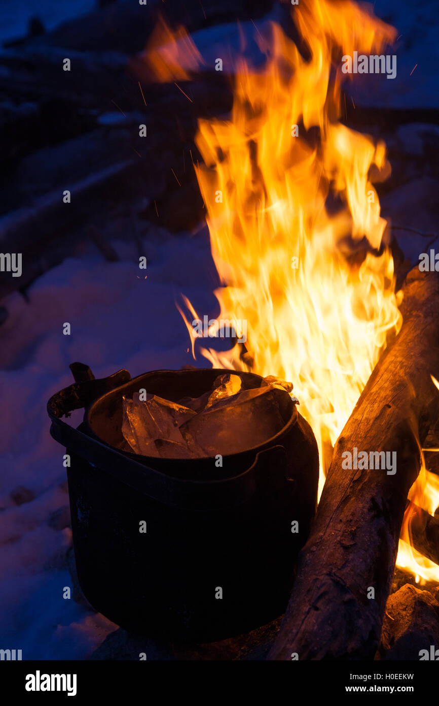 https://c8.alamy.com/comp/H0EEKW/ice-in-kettle-and-fire-boiling-water-for-tea-H0EEKW.jpg
