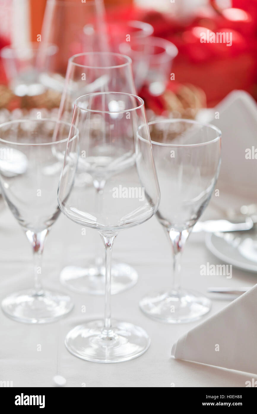 Wine and water glasses on a white tablecloth Stock Photo