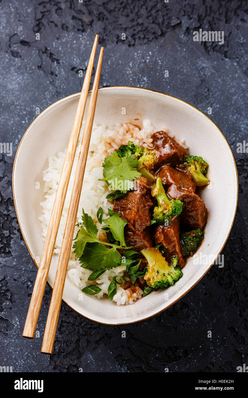 Slow cooked Beef with Rice and Broccoli in bowl Stock Photo