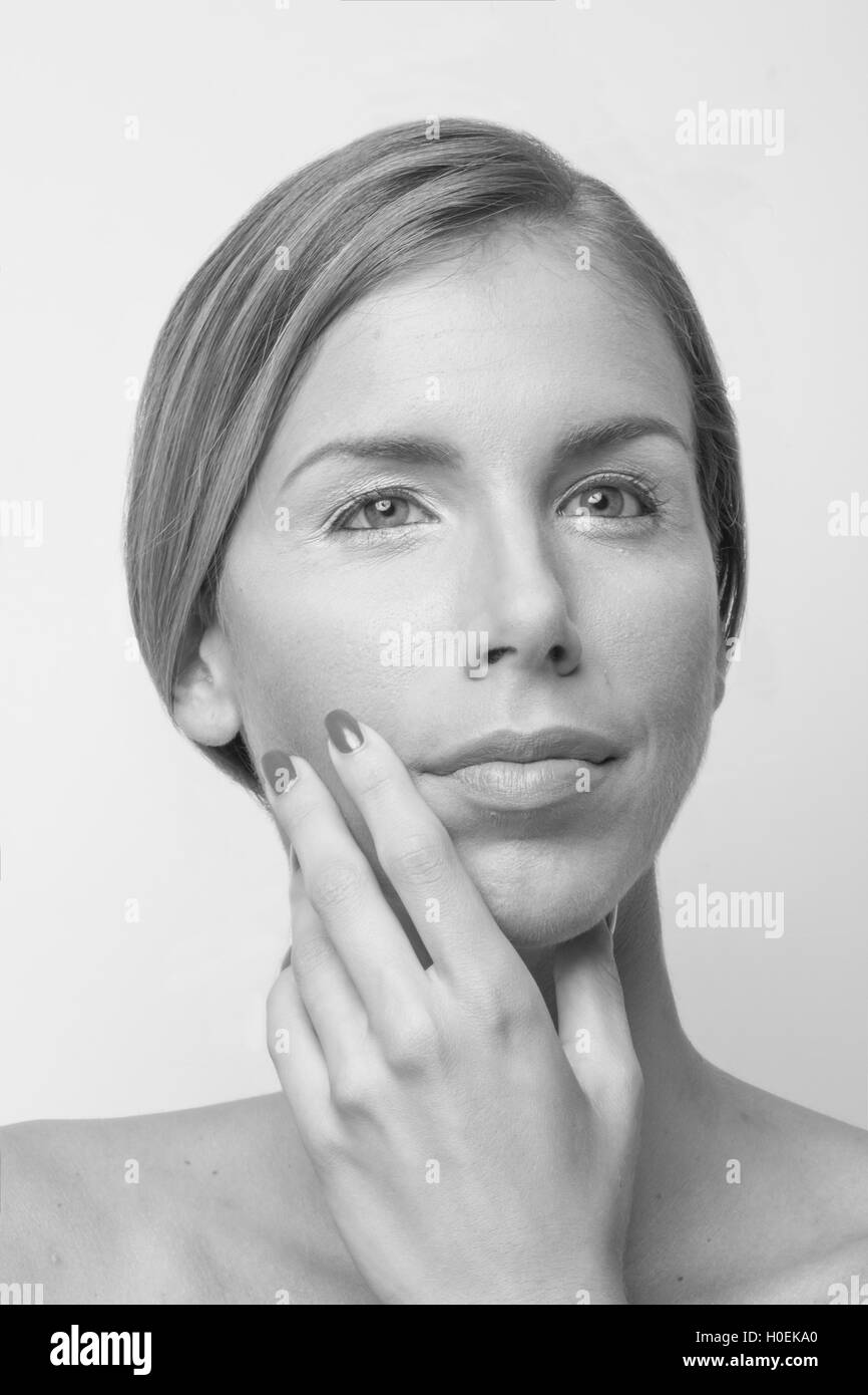 One young woman hand beautiful face head black and white Stock Photo