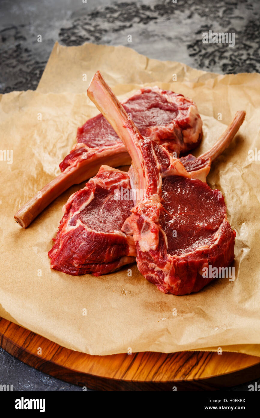 Raw fresh meat Veal rib Steak on bone on dark background Stock Photo