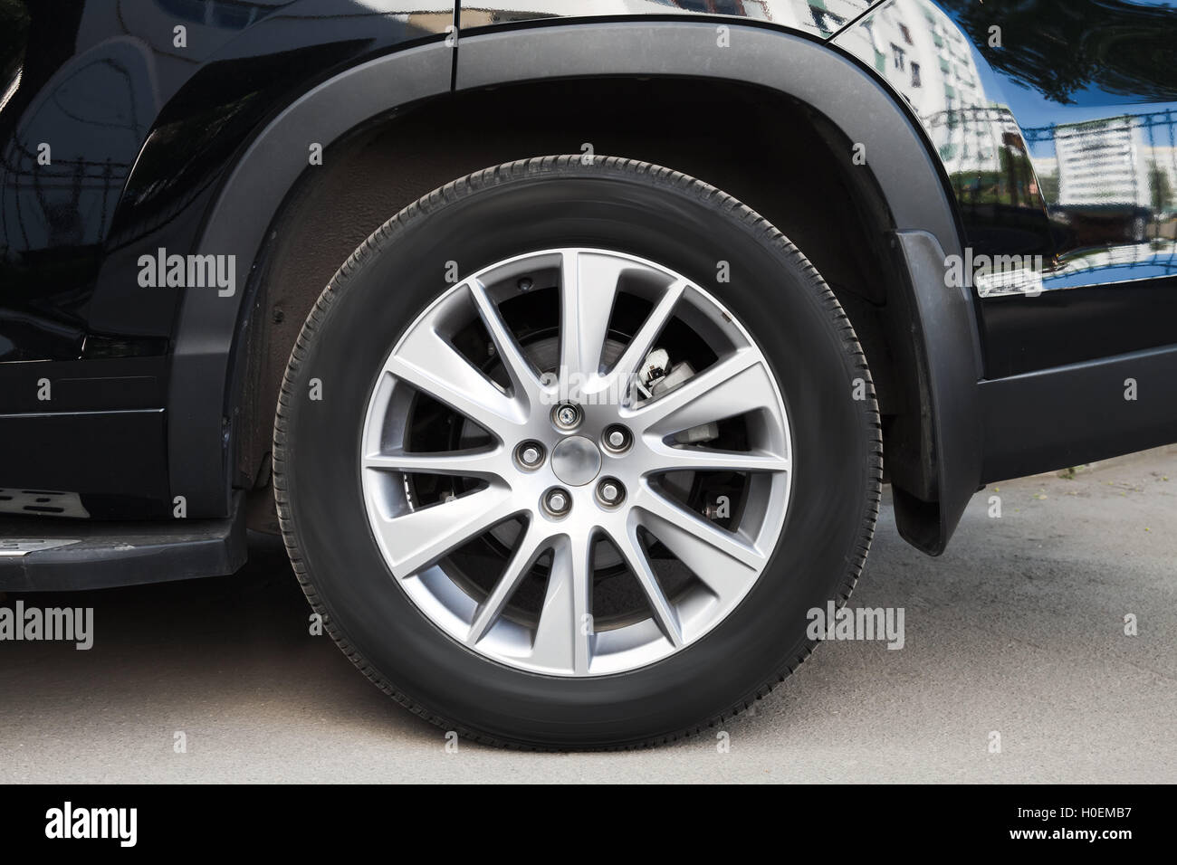 Suv Car Rims Example Modern suv car wheel on asphalt road, closeup frontal photo Stock Photo ...