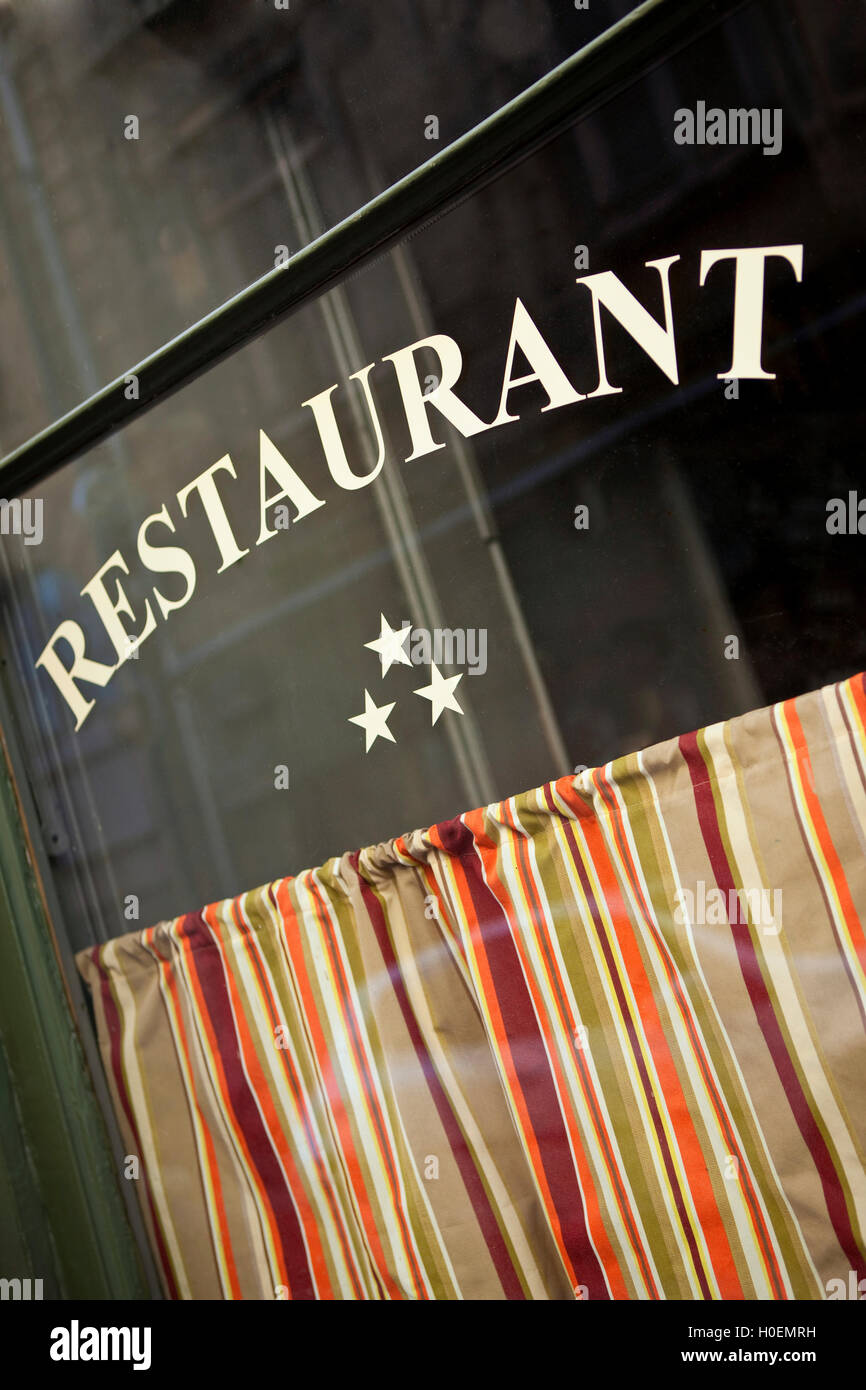 Window and curtain of a three stars French restaurant Stock Photo