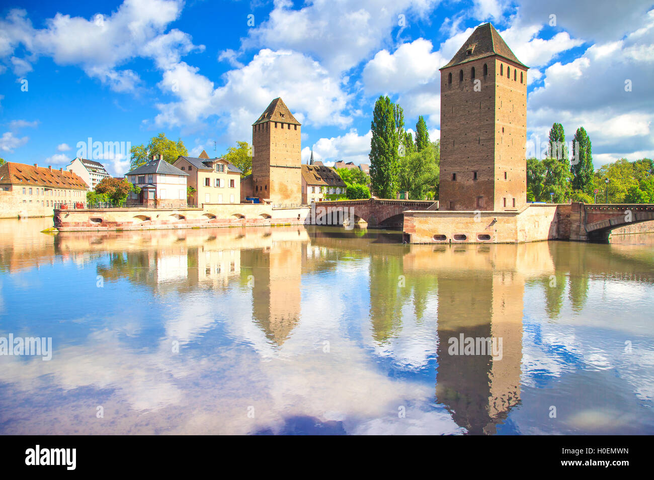 Strasbourg, tower of medieval bridge Ponts Couverts and reflection, Barrage Vauban. Alsace, France. Stock Photo