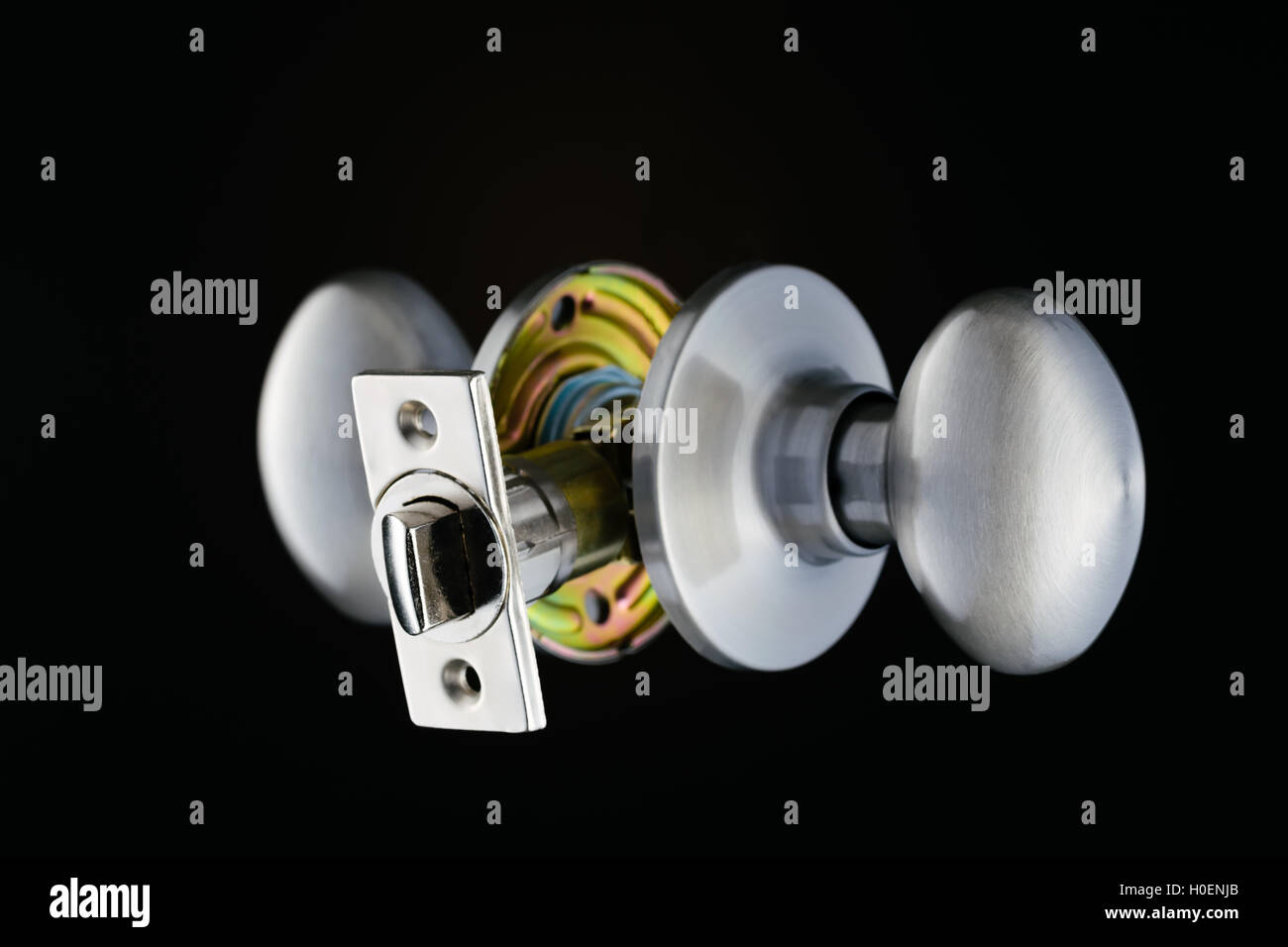 Complete door knob mechanism isolated on black background Stock Photo