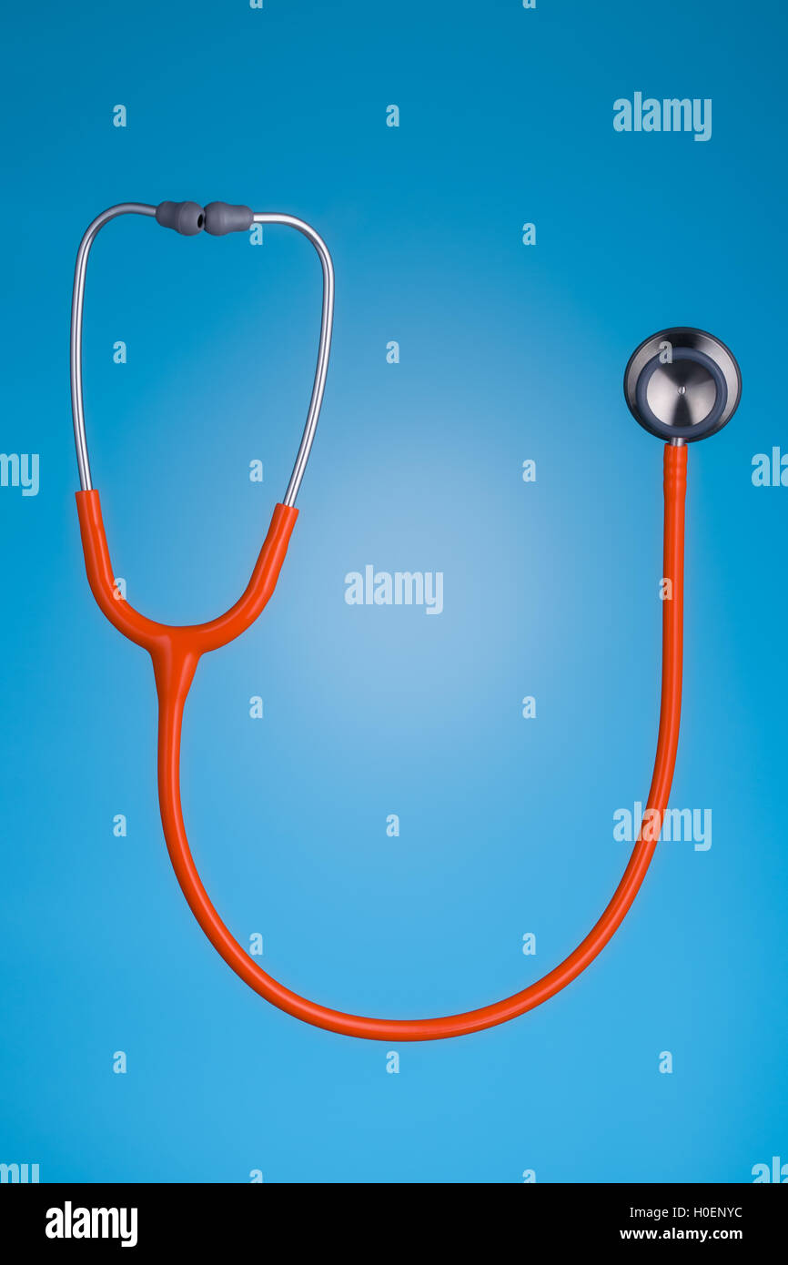 Orange stethoscope isolated on blue background Stock Photo Alamy