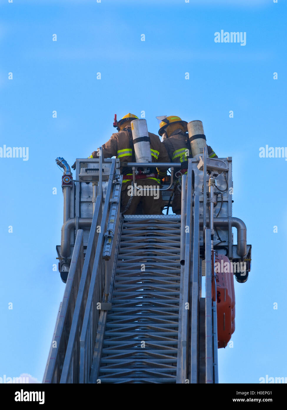 Ladder truck with firefighter Stock Photo Alamy