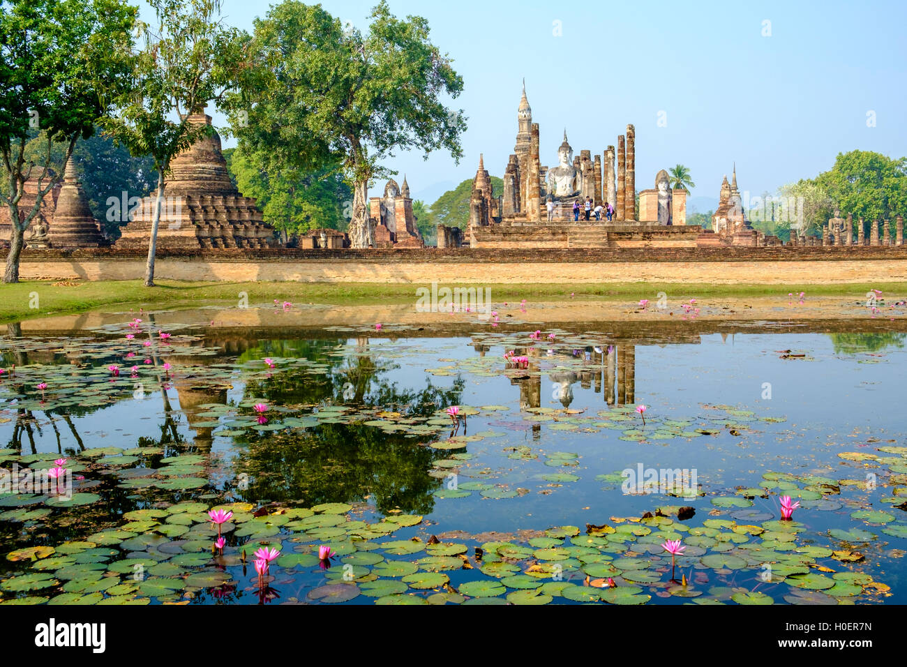 Wat Mahathat temple and pond at Sukhothai Historical Park, Mueang Sukhothai District, Thailand. Stock Photo