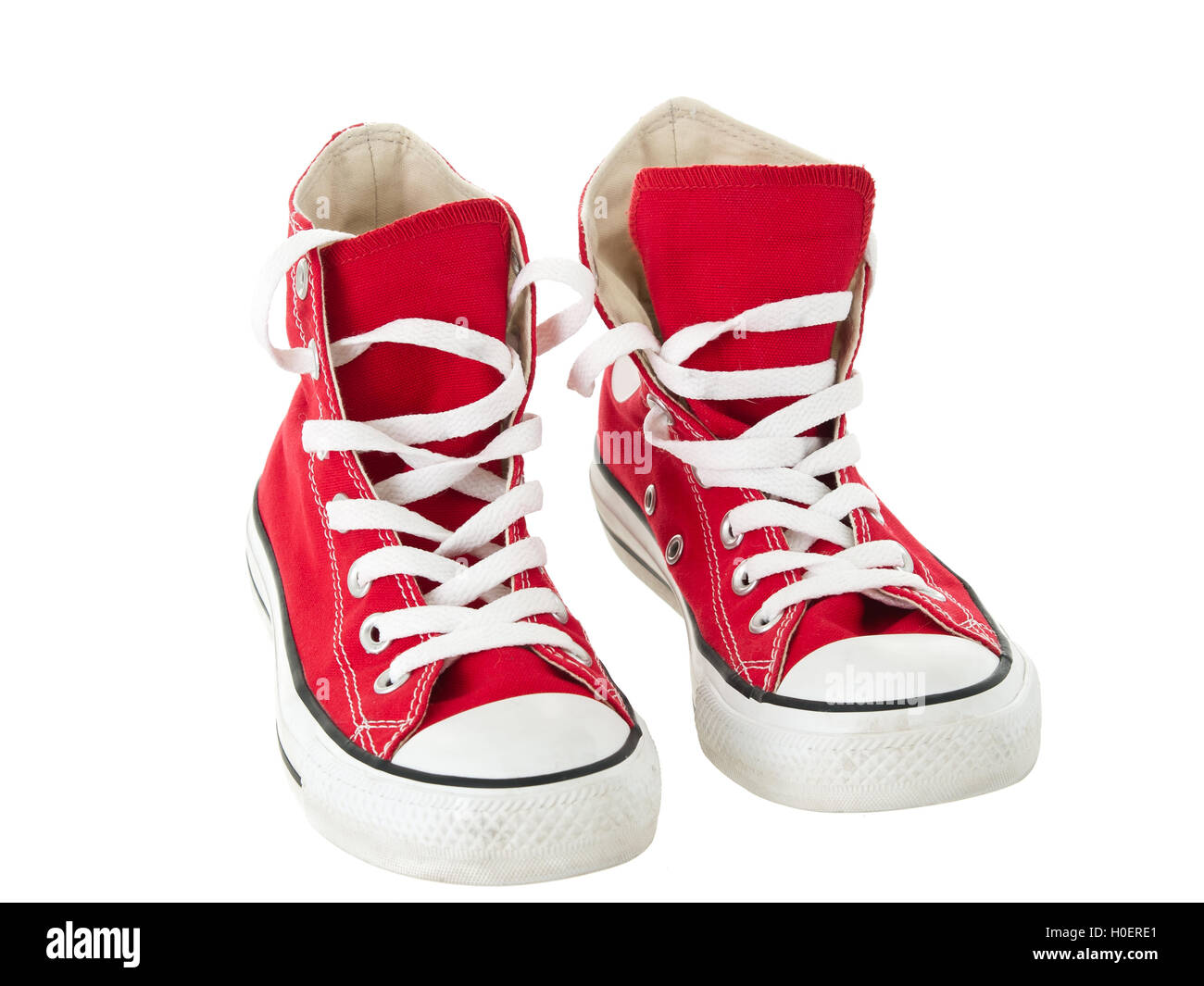 Vintage hanging red shoes on pure white background Stock Photo - Alamy