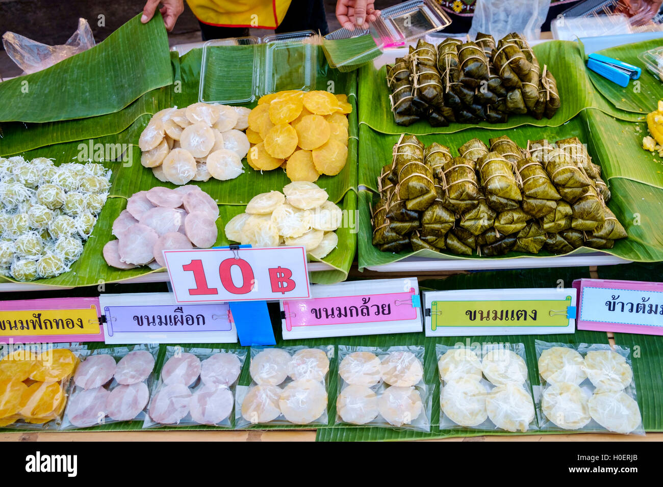 Sweets at a stall in a street food market in Sukhothai, Mueang ...