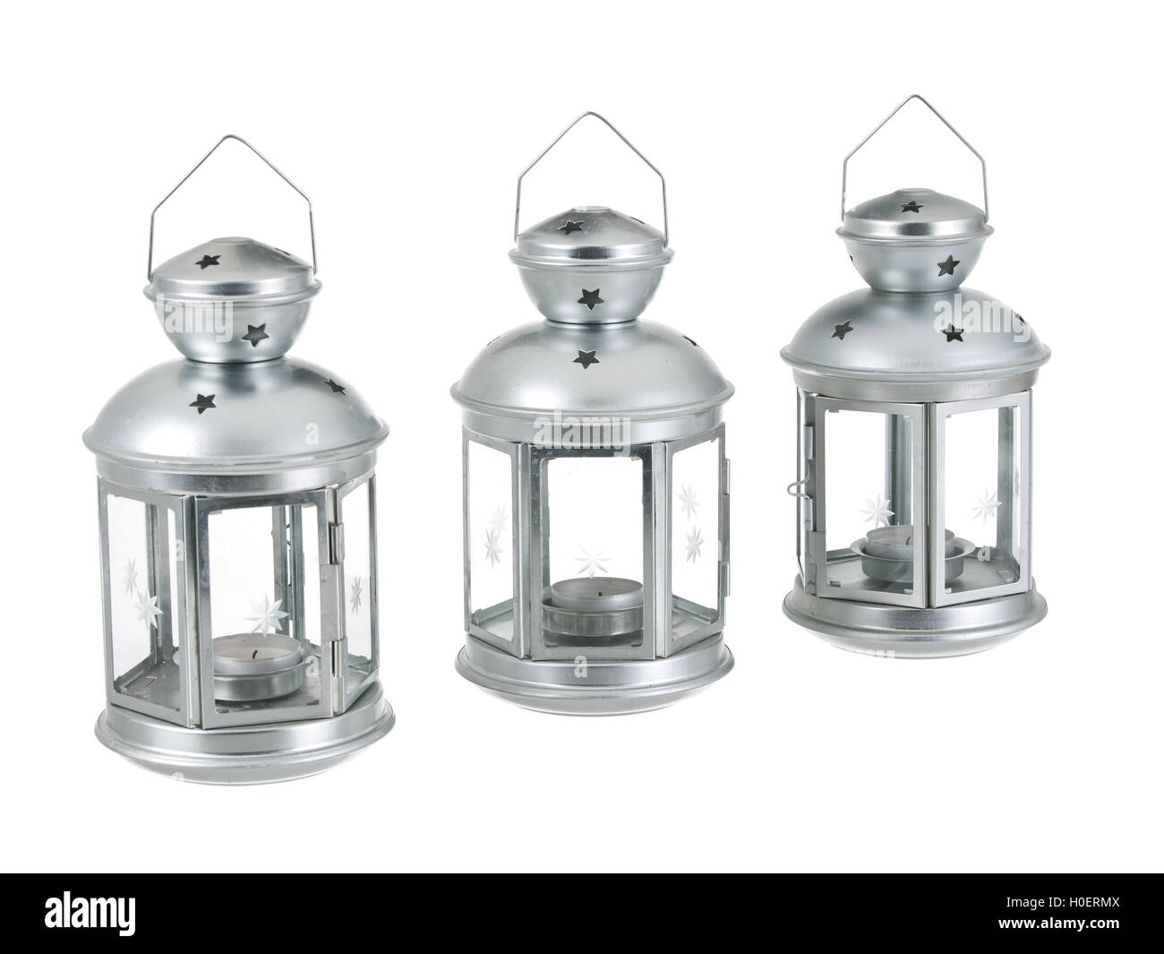 Tin grey metal lantern trio row on pure white background Stock Photo