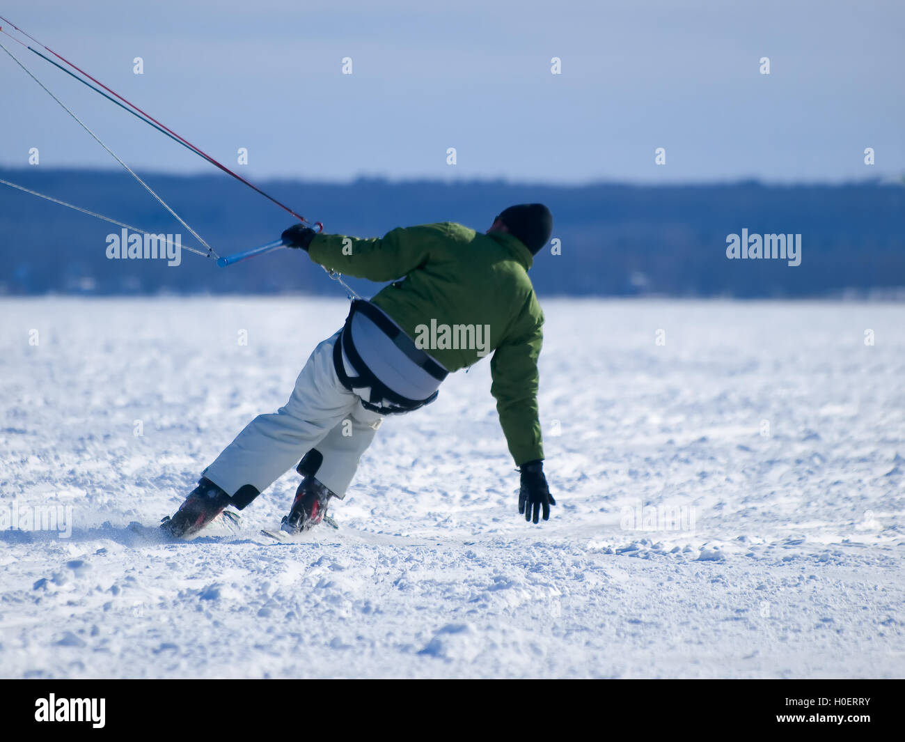 Men ski kiting on a frozen lake Stock Photo