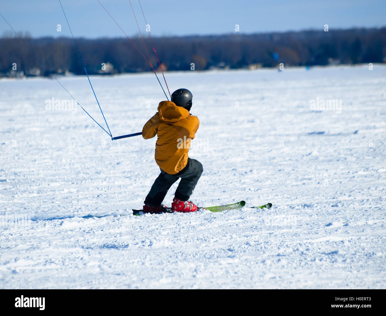 Men ski kiting on a frozen lake Stock Photo