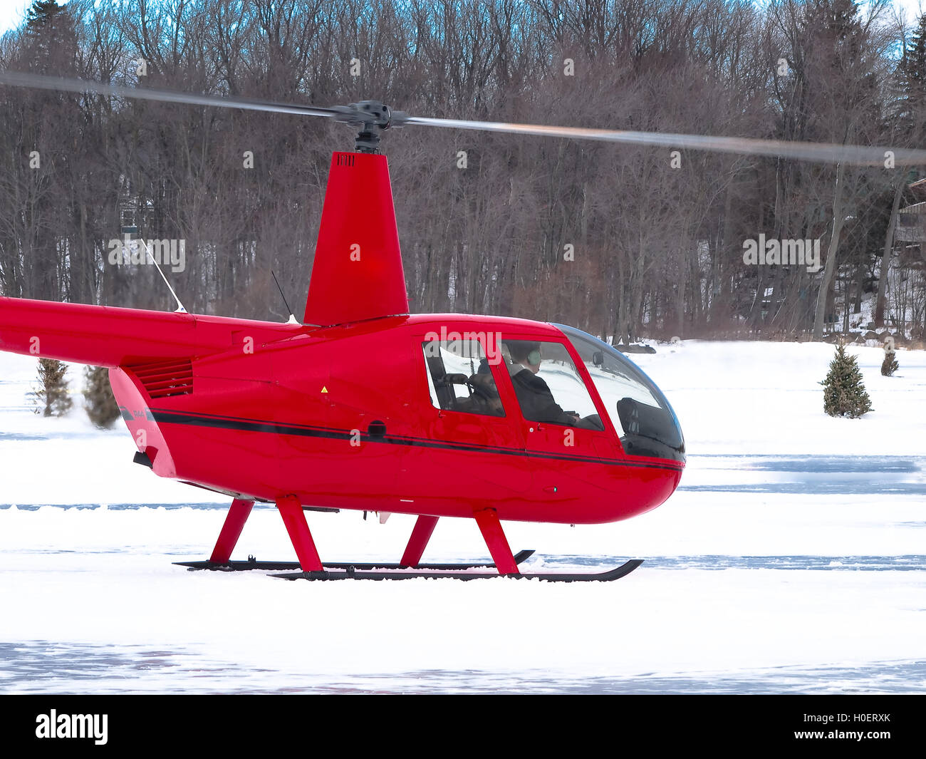 Red helicopter in winter Stock Photo