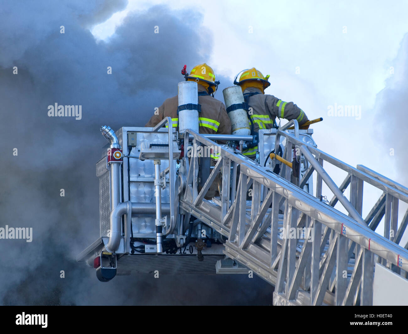 Ladder truck with firefighter Stock Photo Alamy