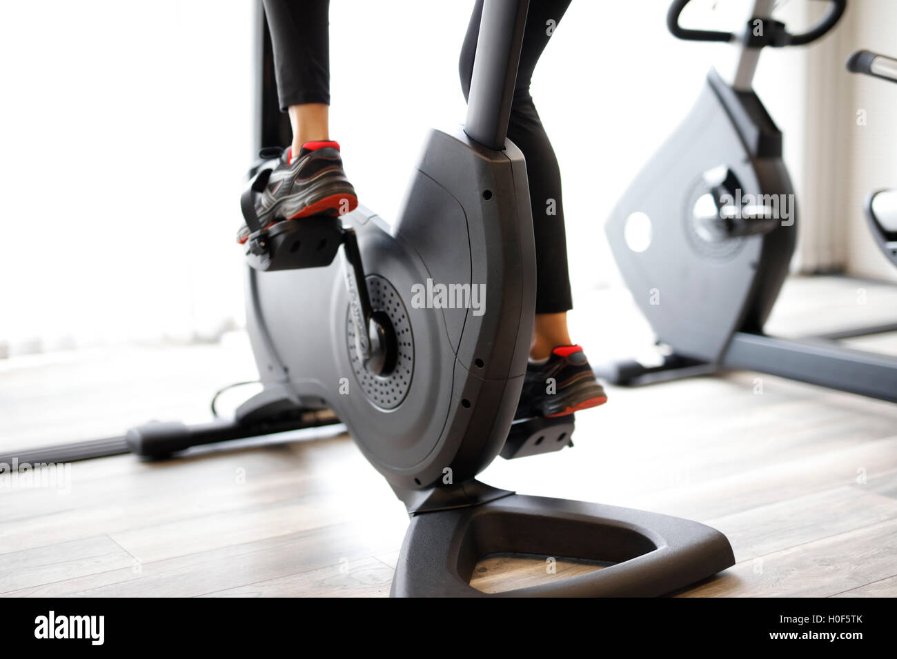 Woman at sport fitness gym weight training for beauty body. Girl doing