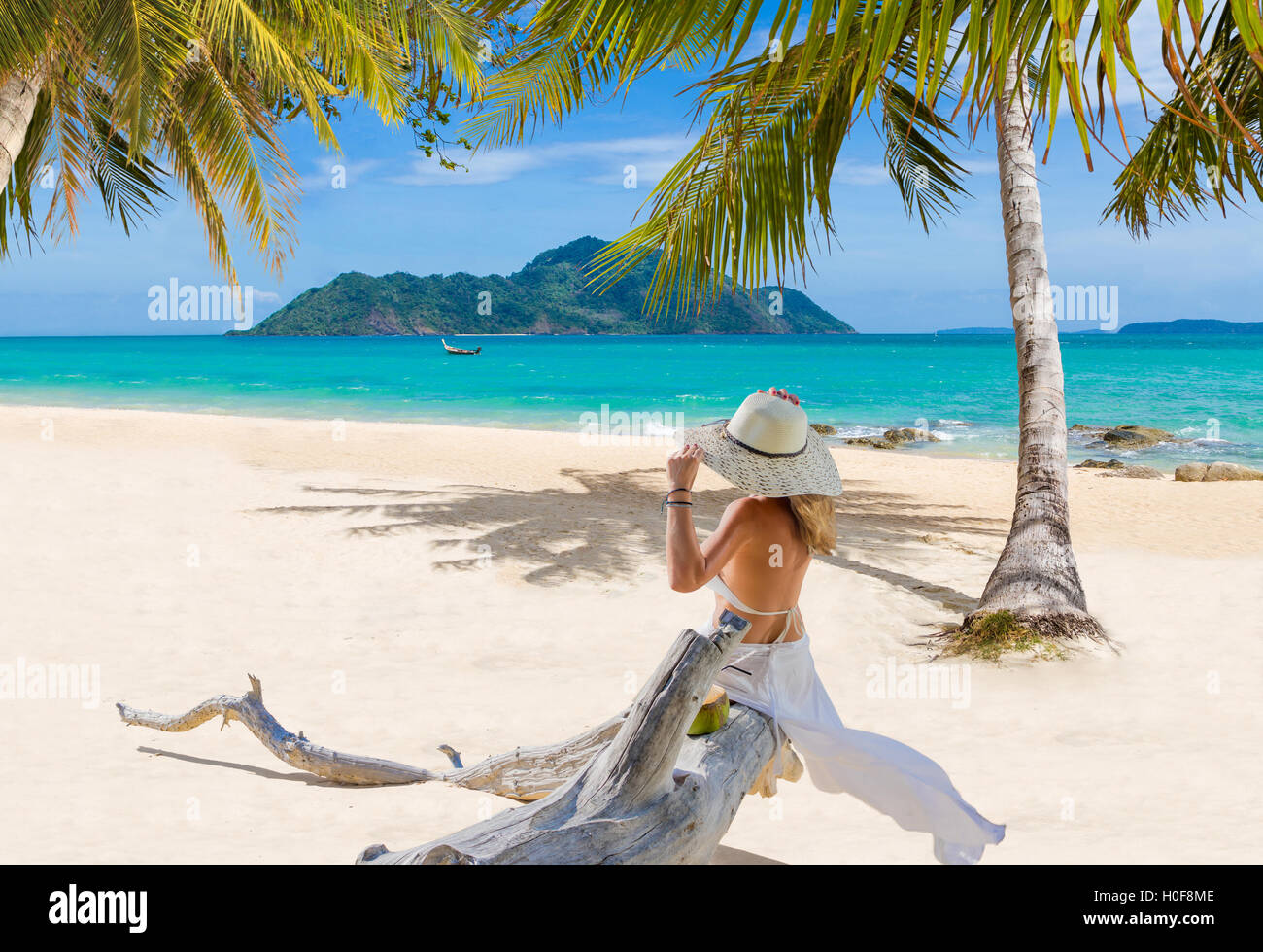 Woman on the beach with hat Stock Photo - Alamy