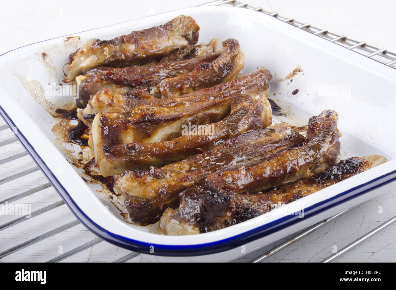 fresh grilled spare ribs in an enamel bowl Stock Photo