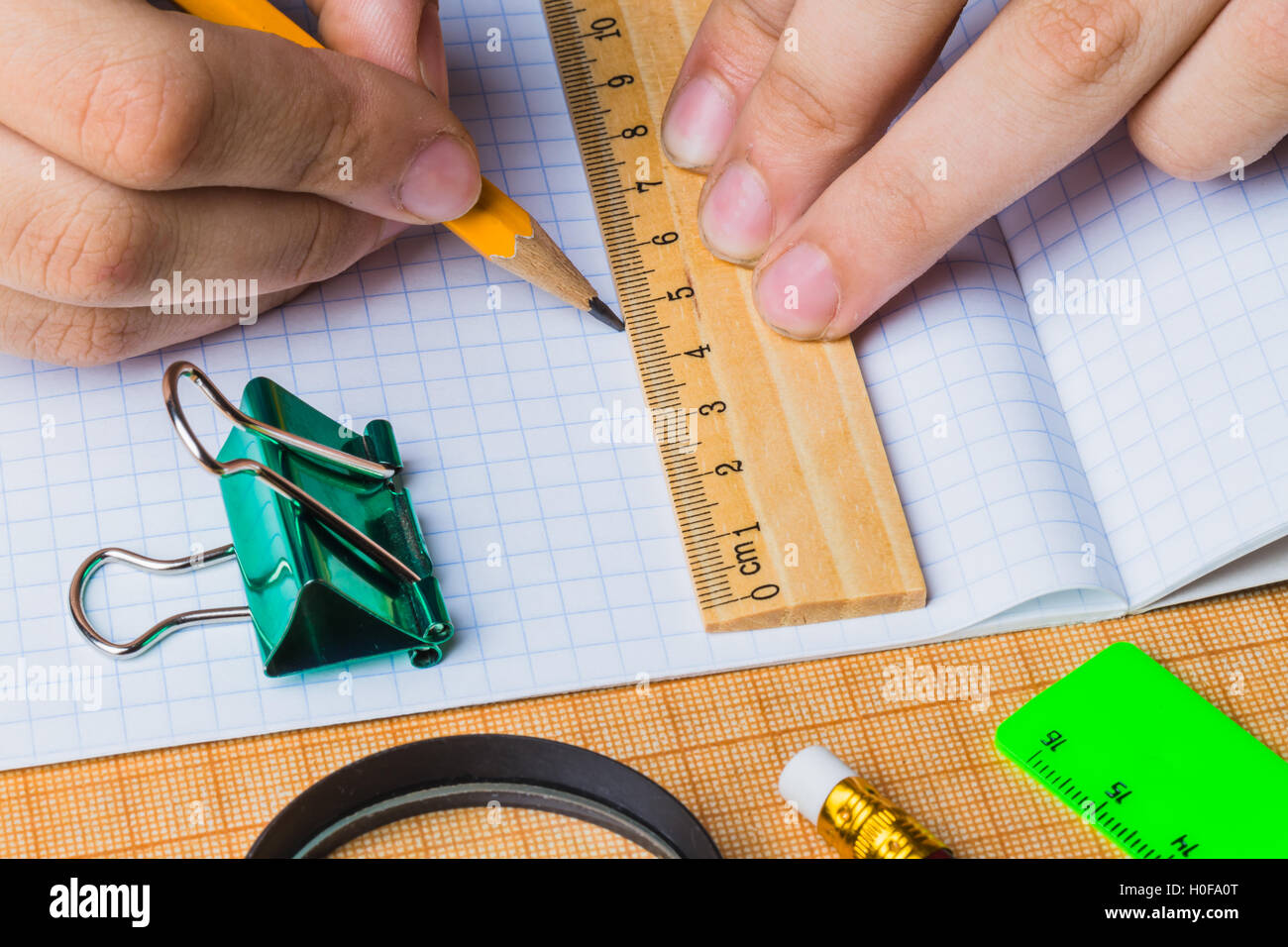 draftsman draws on a ruler Stock Photo