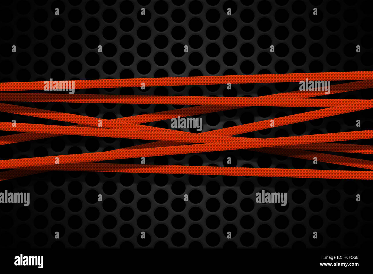 orange carbon fiber frame on black mesh carbon background. metal