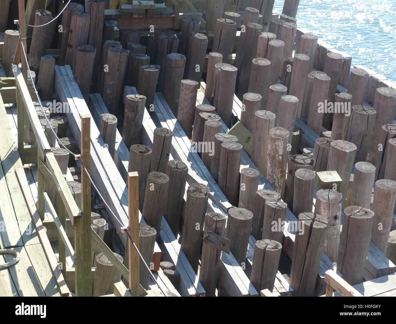 Pressure treated wood pillars of Staten Island Ferry docks Stock Photo