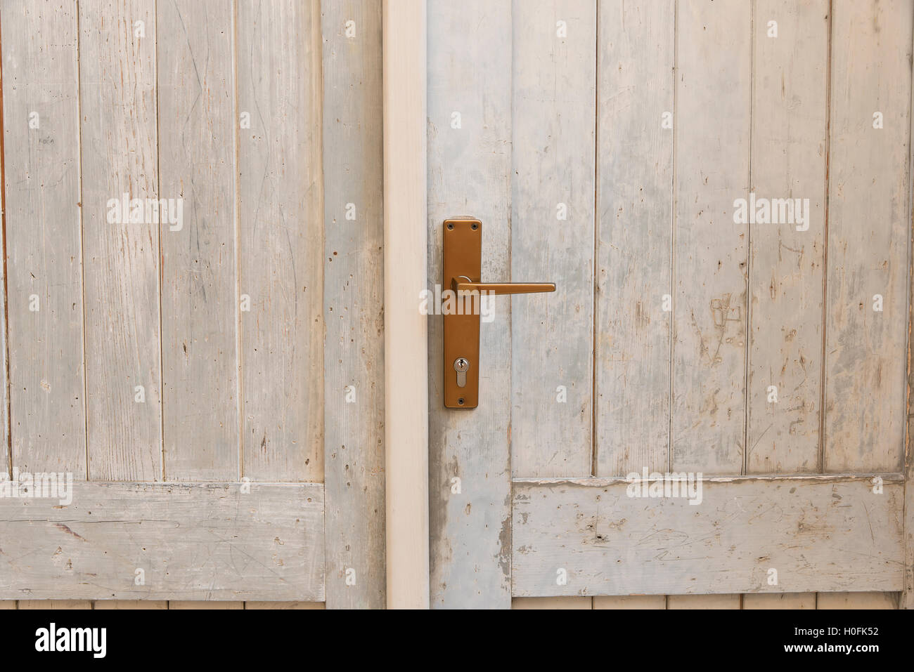 close up of an old white wooden door with a lock Stock Photo - Alamy