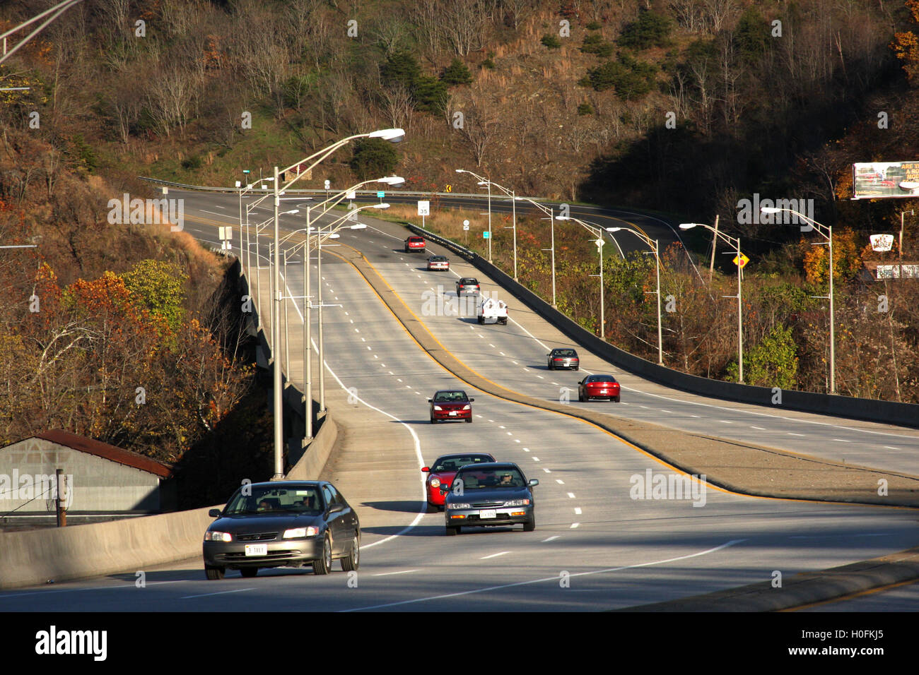 Vehicles crossing bridge over James River in downtown Lynchburg