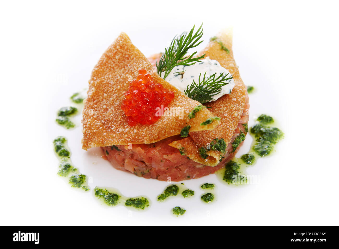 Tartar of smoked salmon with spicy cream cheese, celery and red caviar Stock Photo