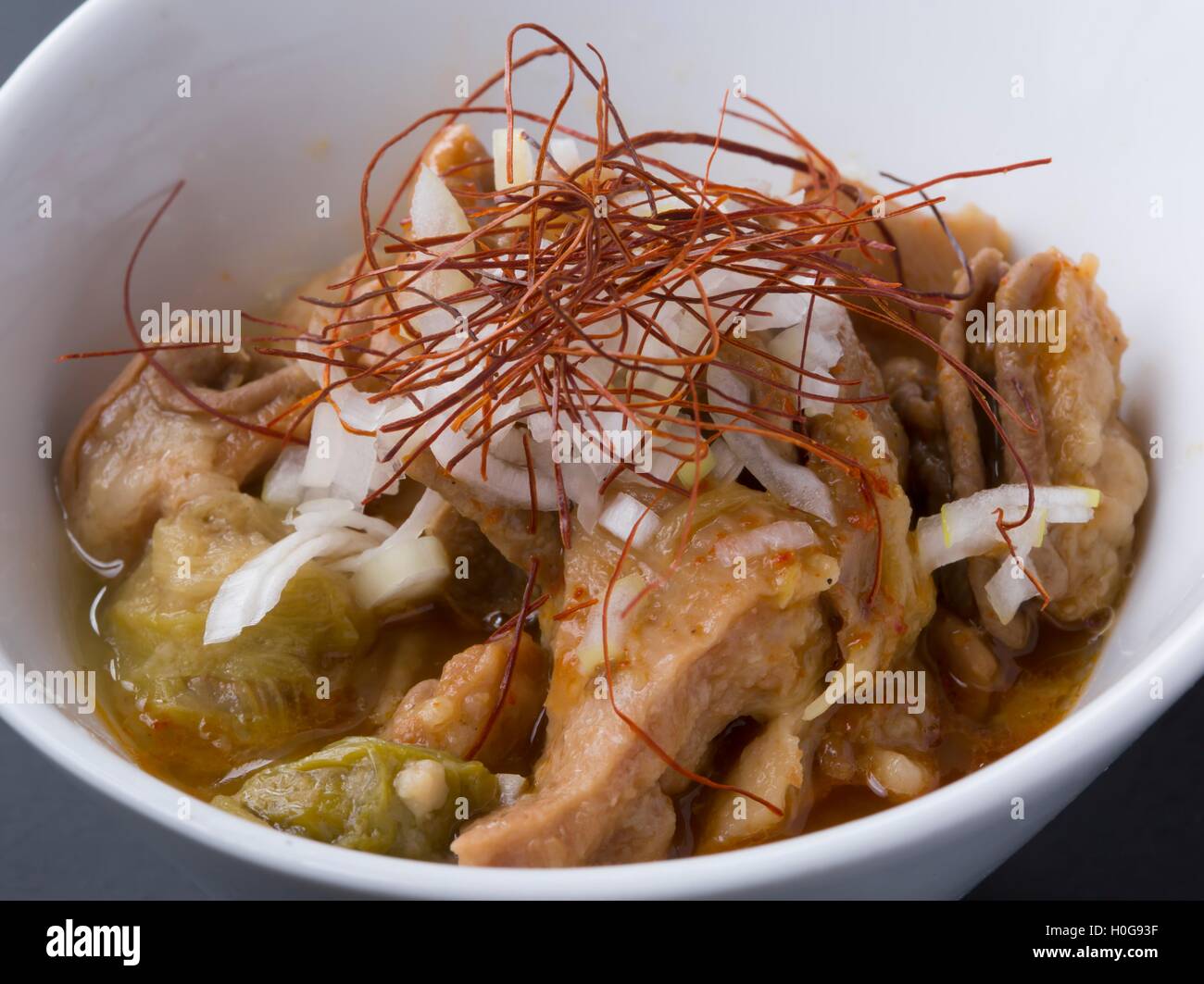 Japanese Wagyu Motu stew miso with onion and soup in white bowl Stock