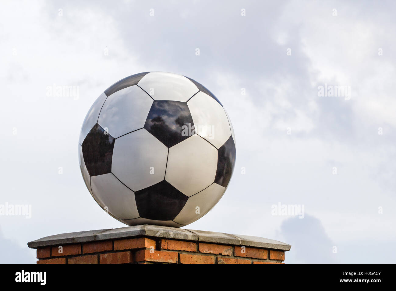 Soccer ball made of marble, decorative architectural element Stock
