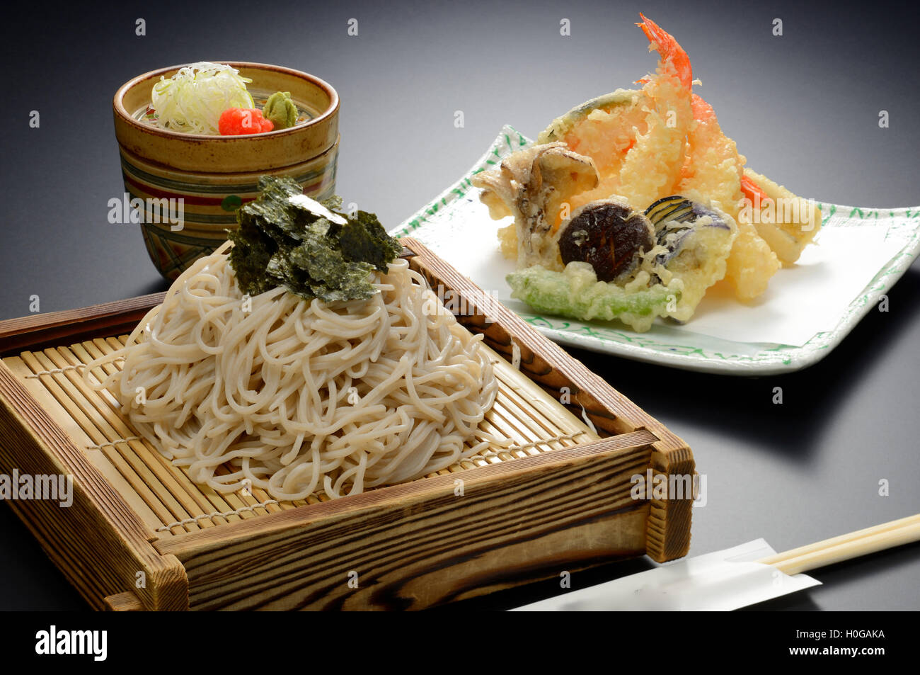 Japanese Udon noodle with seaweed and shrimp tempura on bamboo tray