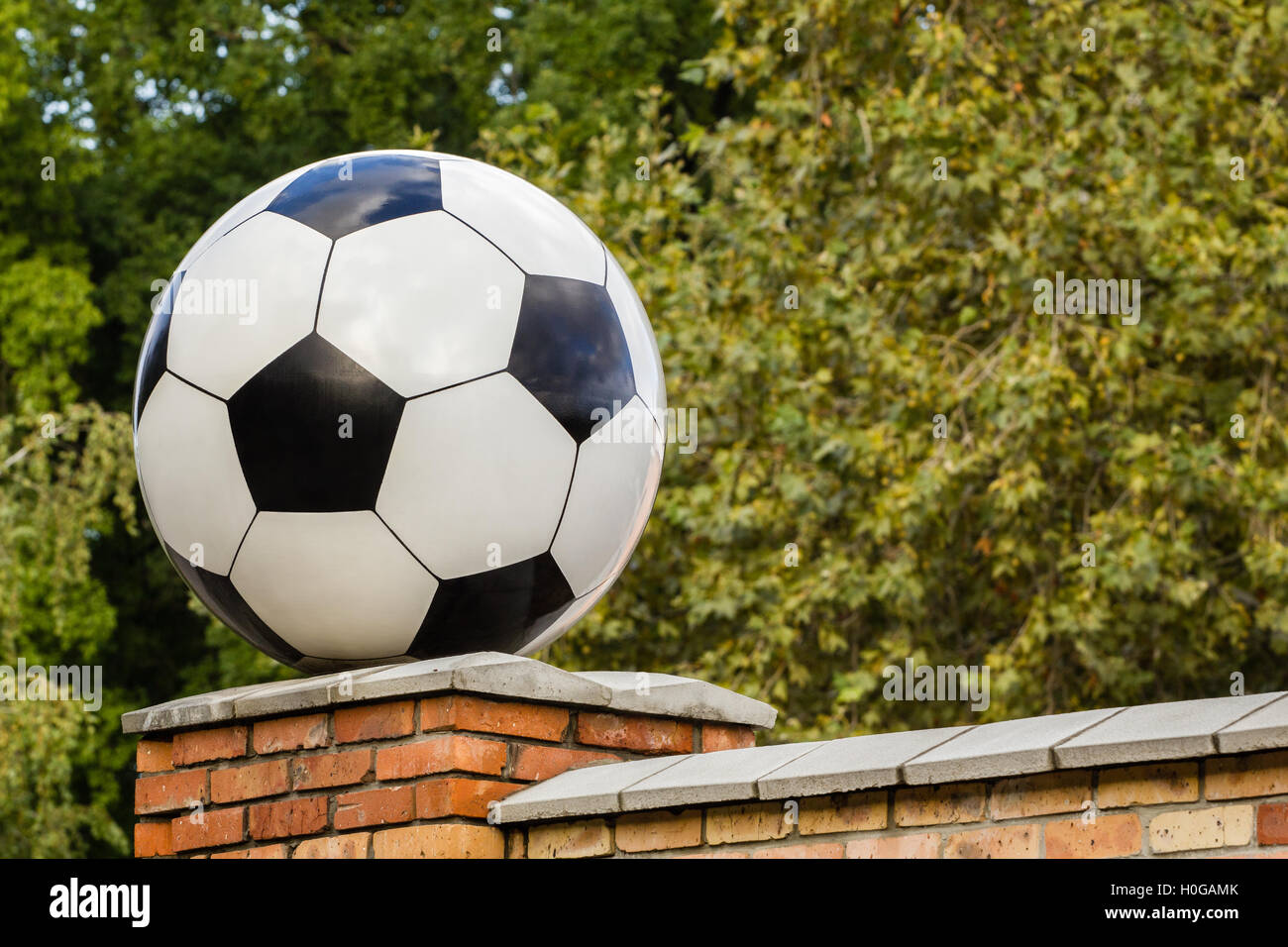 Soccer ball made of marble, decorative architectural element Stock