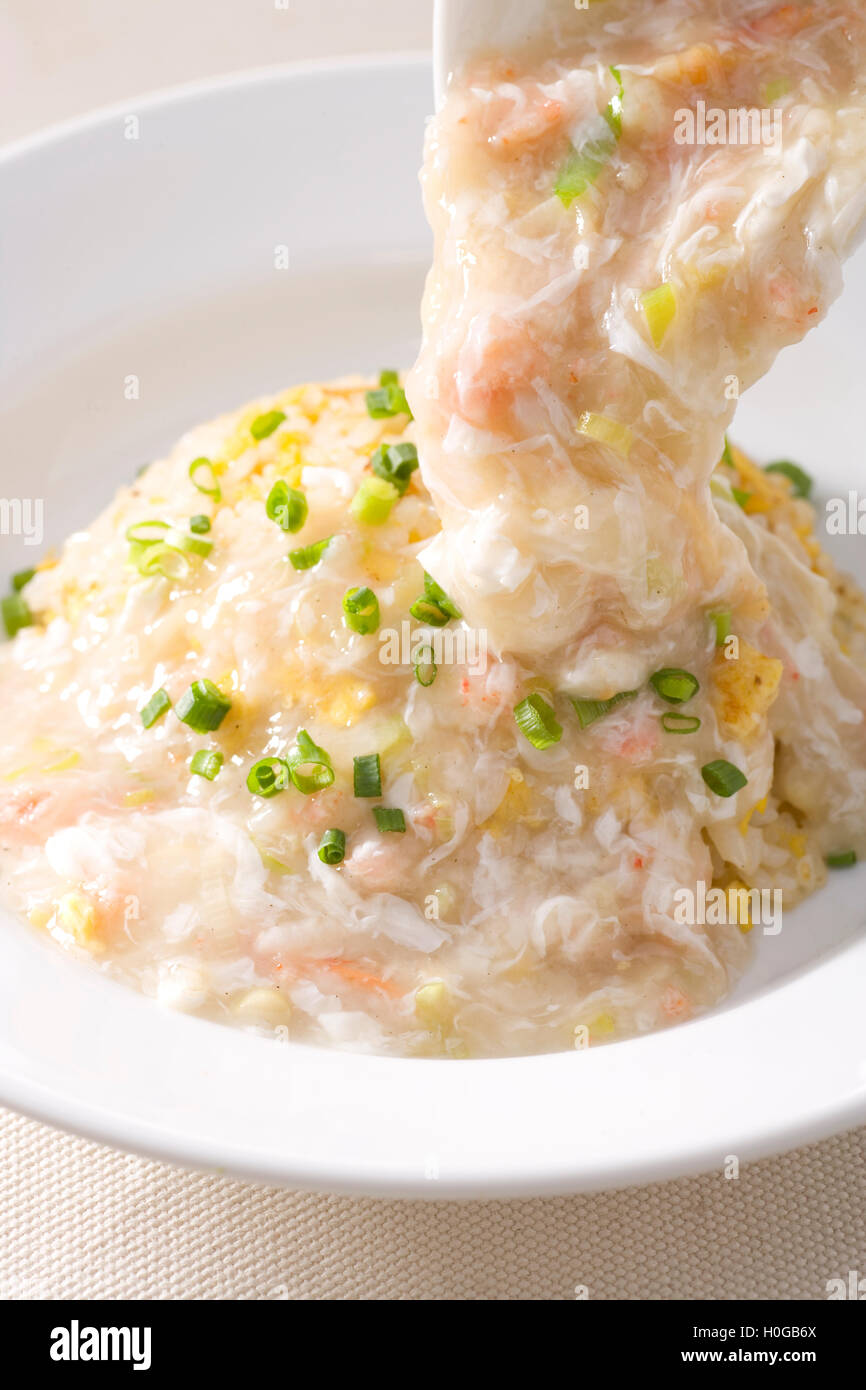 Popular with female crab egg and white sauce fried rice porridge Stock