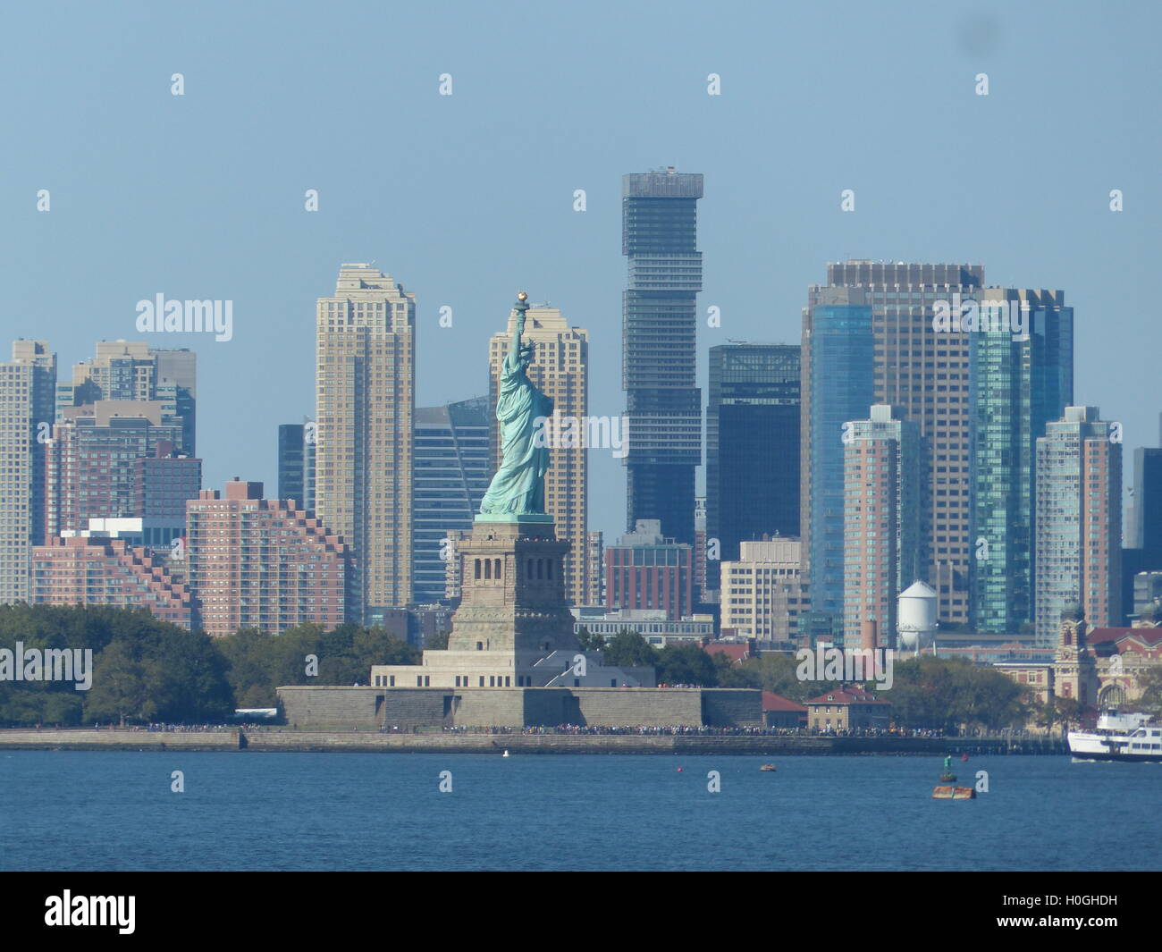 Statue of Liberty with Jersey City office towers viewed from Staten Island Ferry Stock Photo Alamy