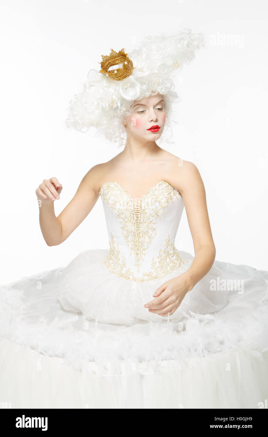 Princess with a golden crown in a white dress Stock Photo - Alamy
