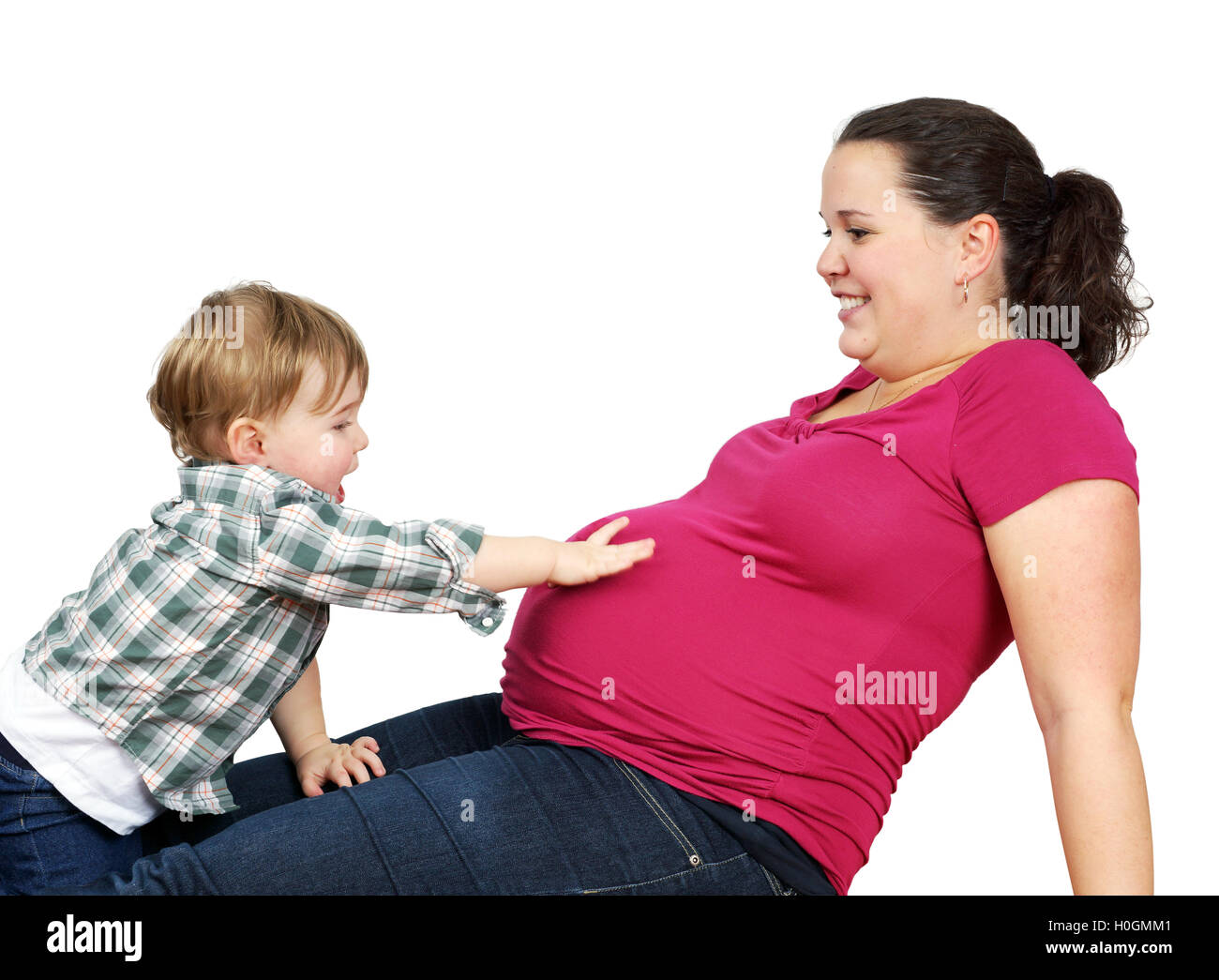 Little boy touching mom belly Stock Photo Alamy