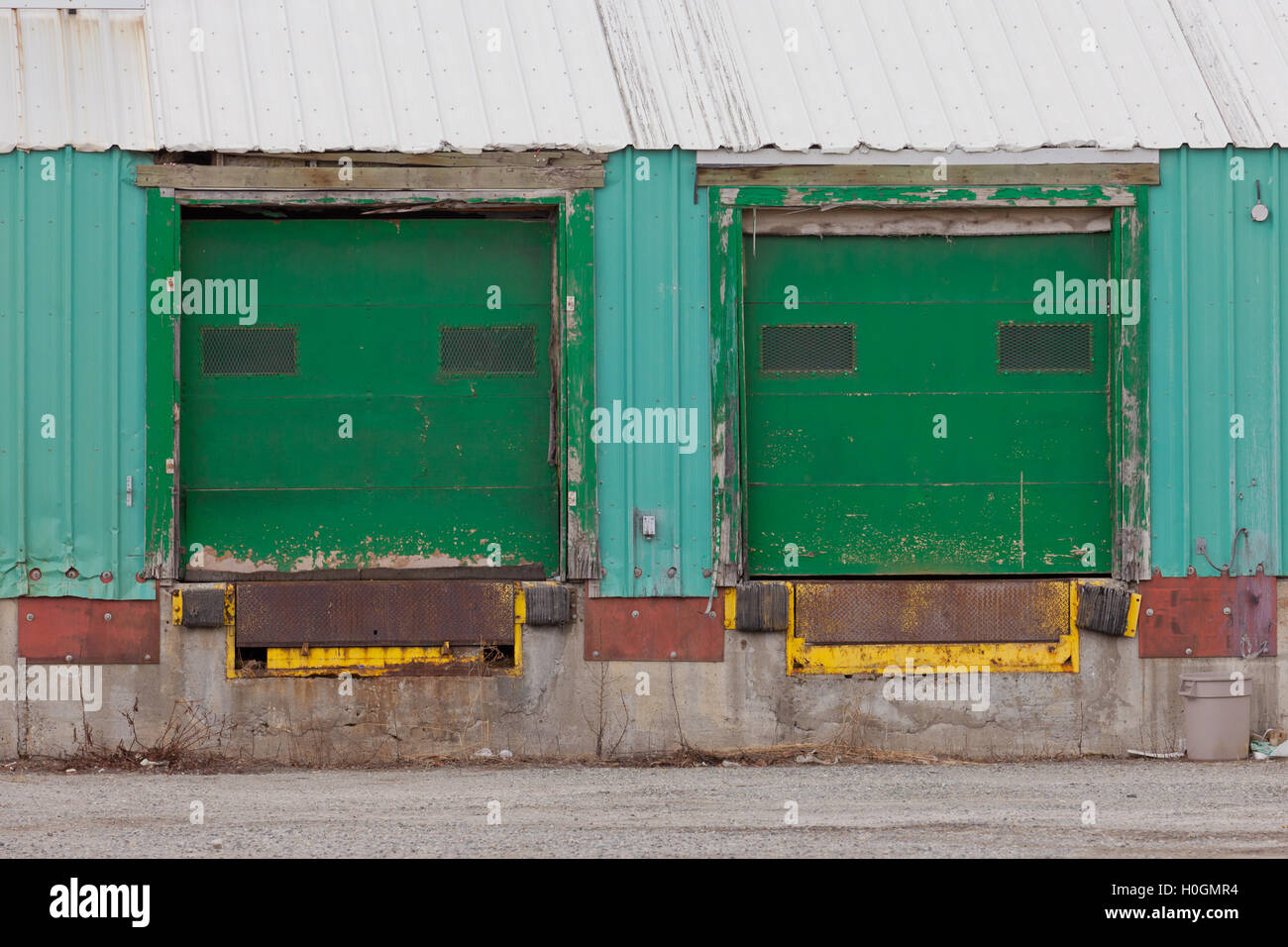 Two green shuttered outside loading gate ramps Stock Photo - Alamy