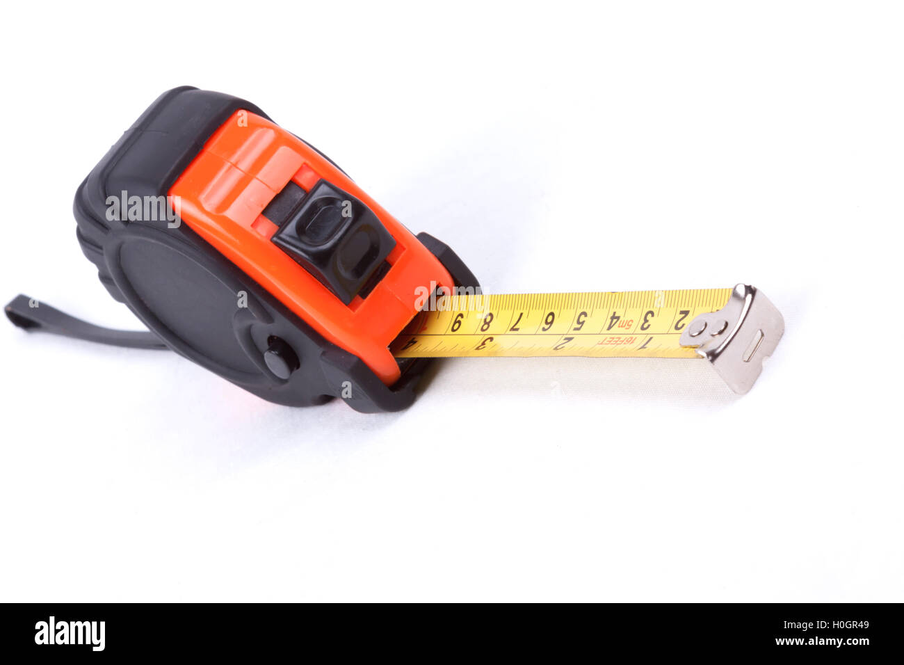 Closeup of a measuring tape on white background Stock Photo - Alamy