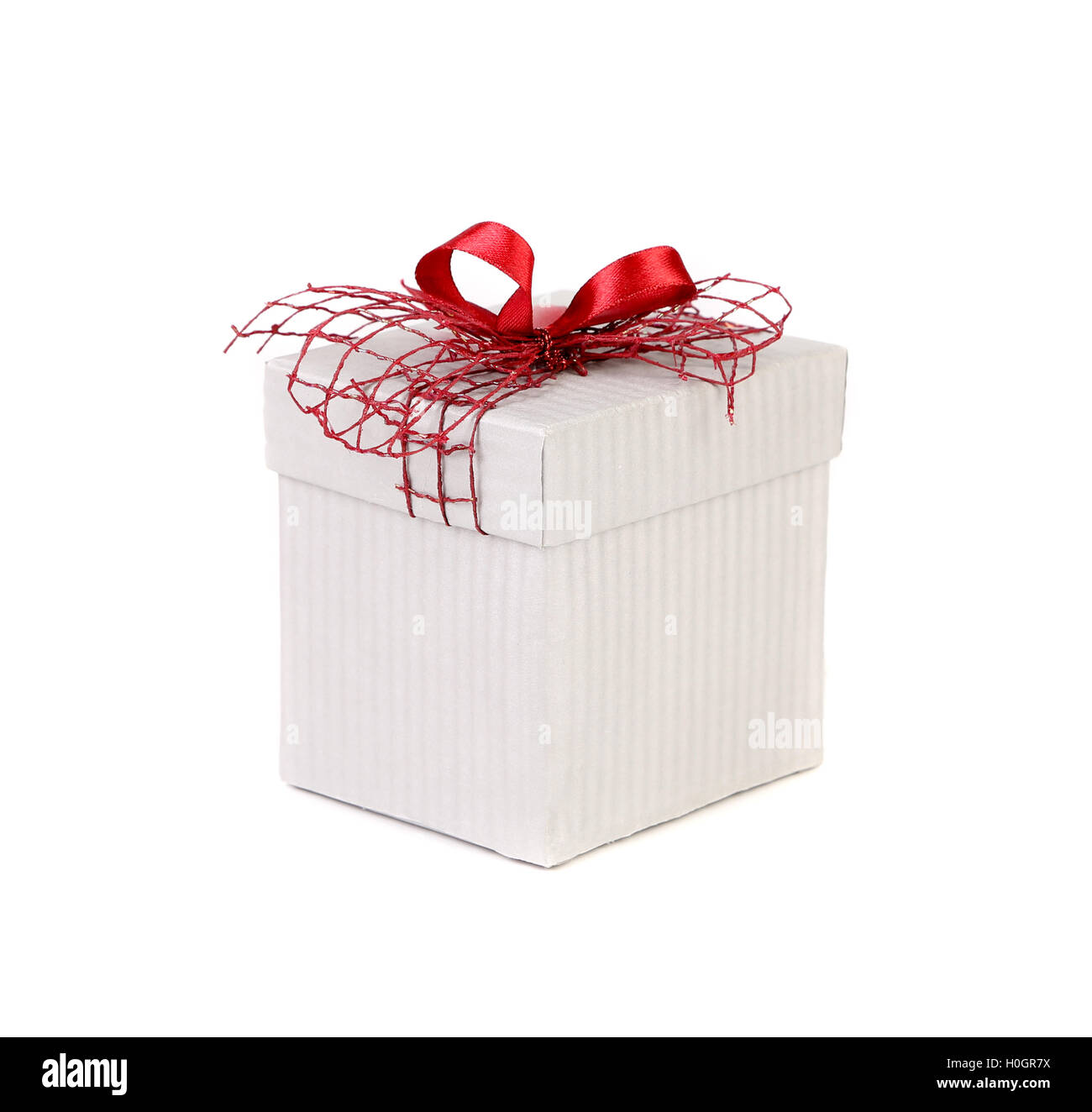 White gift box with red ribbon bow Stock Photo - Alamy