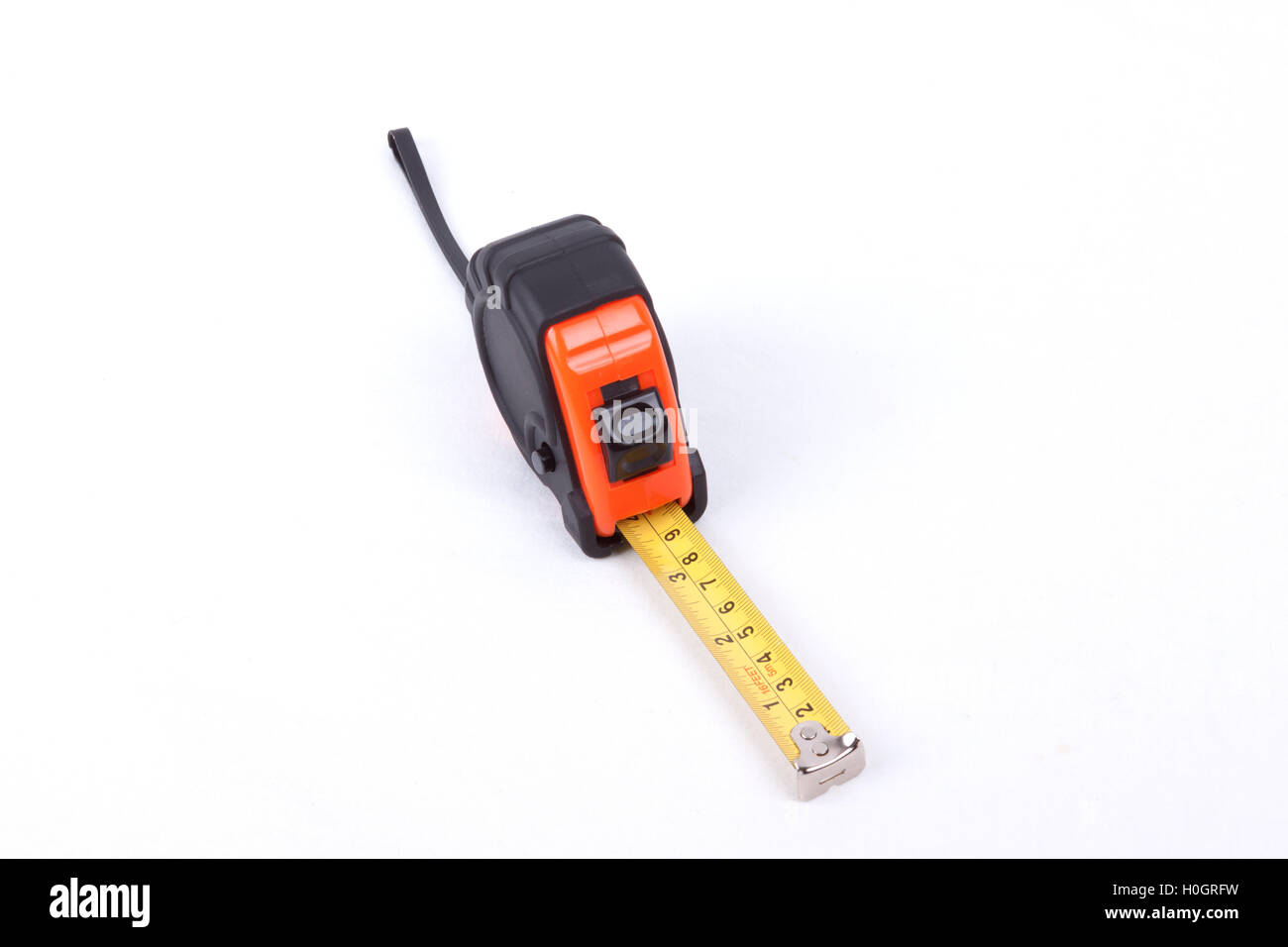 Closeup of a measuring tape on white background Stock Photo - Alamy